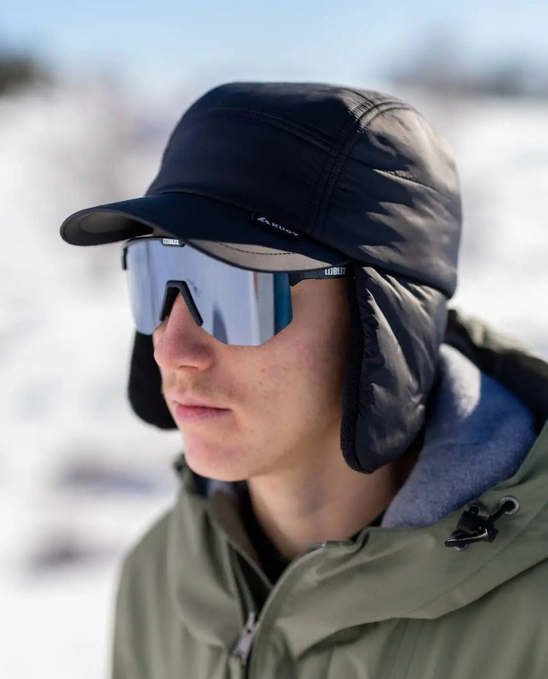 KUGY Insulated Mountain Cap providing ear protection in windy outdoor conditions